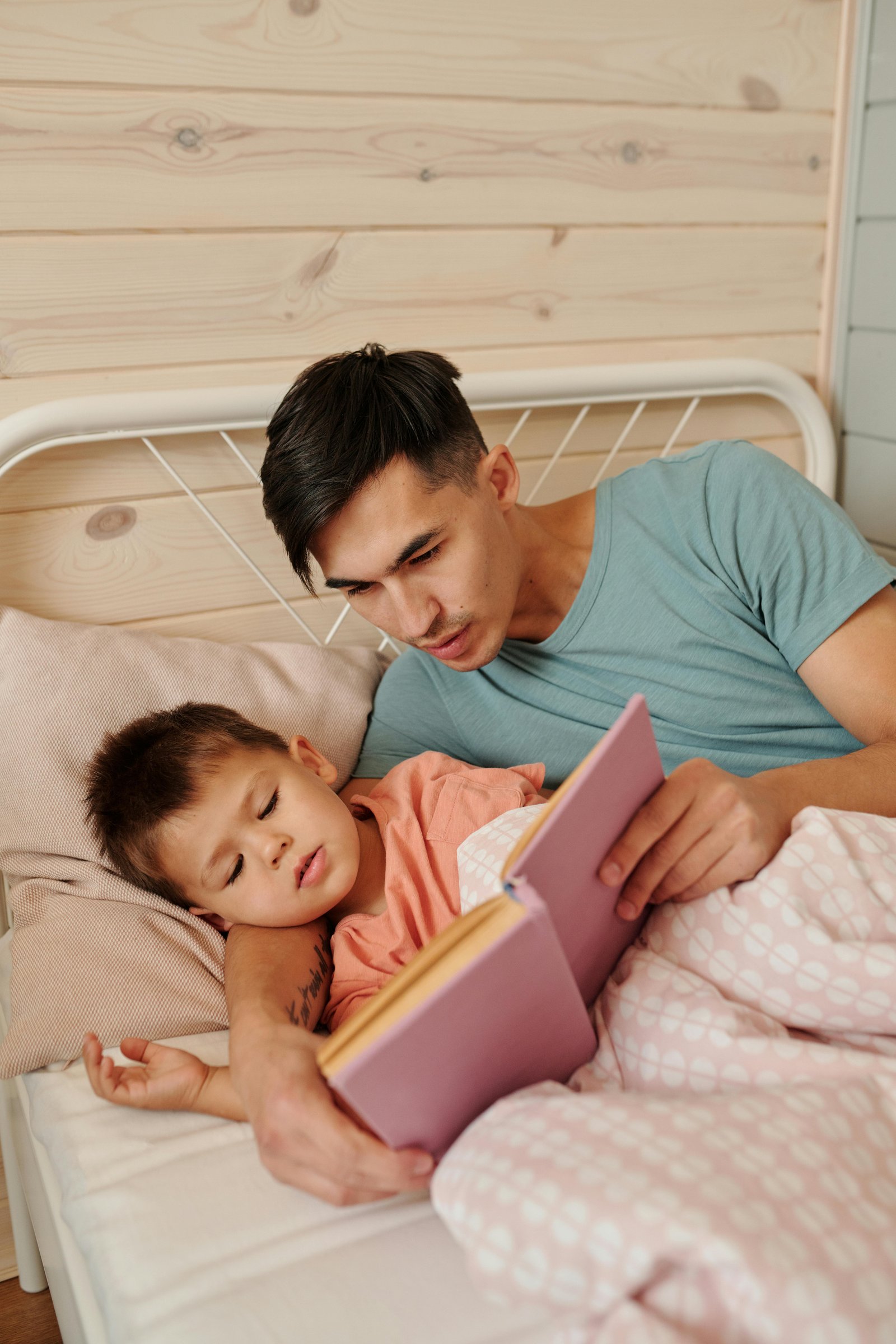 Child enjoying a short calming bedtime story before sleep